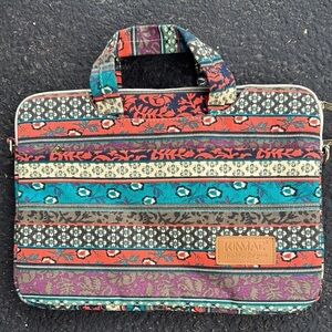 Kinmac bohemian vibe fabric multi pocketed zipper closure laptop/tablet bag.